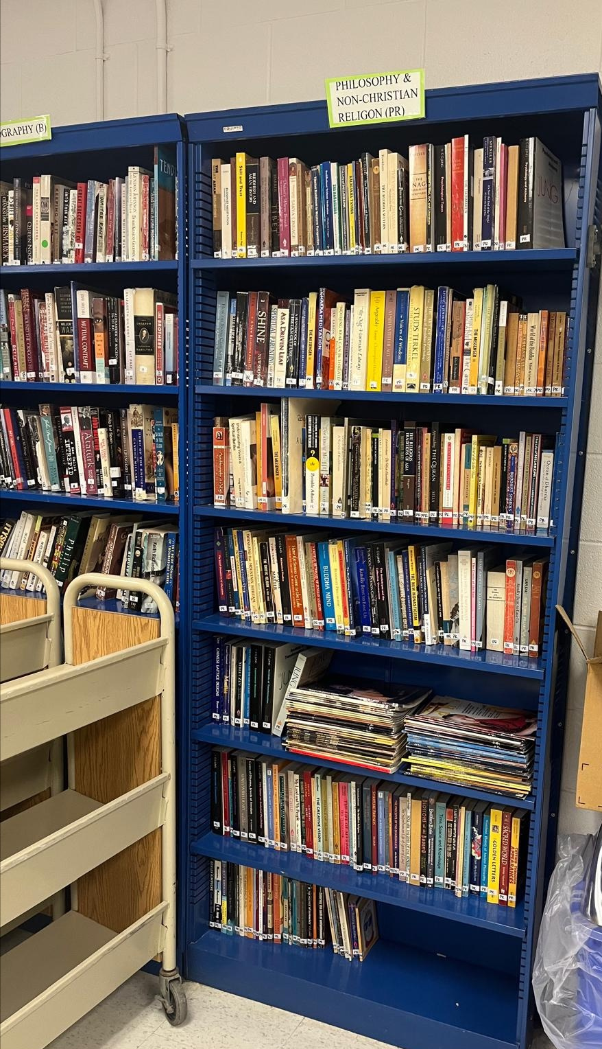 Bookshelves filled with donated dharma books at the Adams County Jail library